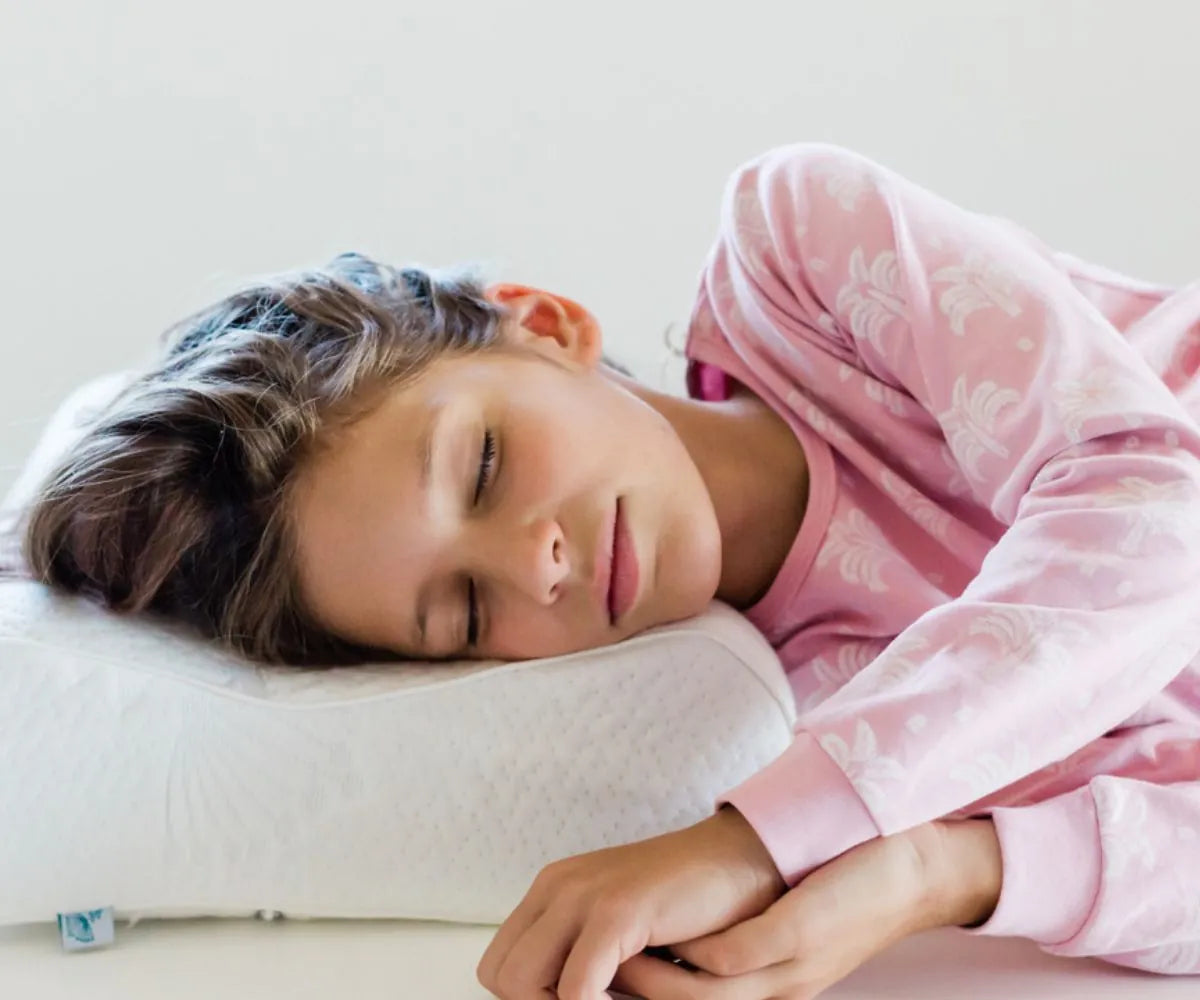 Child peacefully sleeping on the NexGen memory foam children’s pillow
