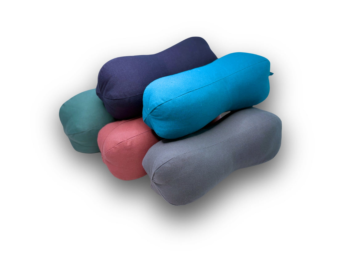 Peanut Pillows in 5 colours stacked on top of each other