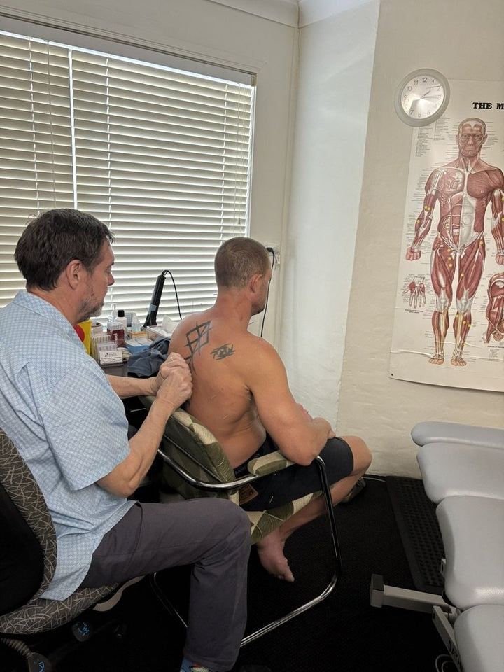 Andrew being dry needled by an osteopath