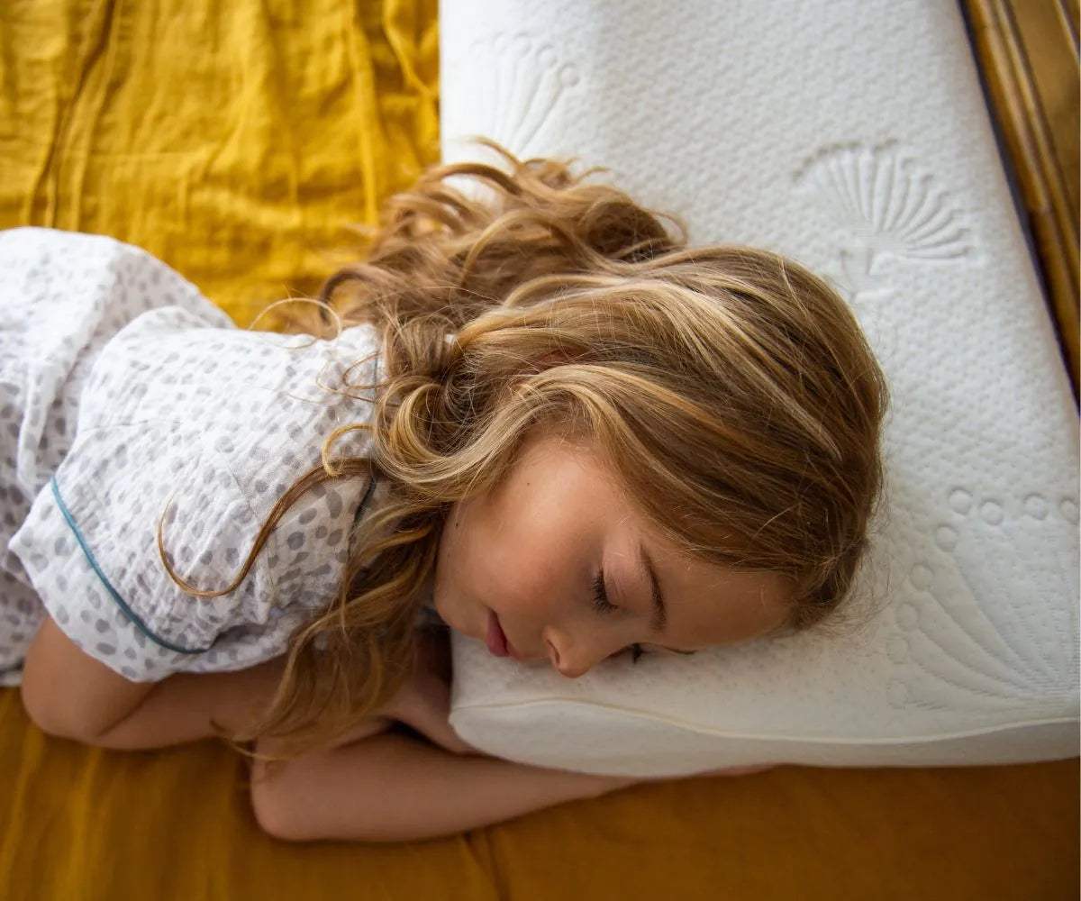 Side view of the adjustable kids pillow showing contour and support 